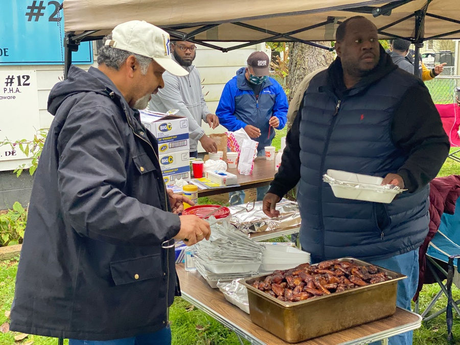 Brothers of Stone Square Lodge No. 22 serving food at a community event