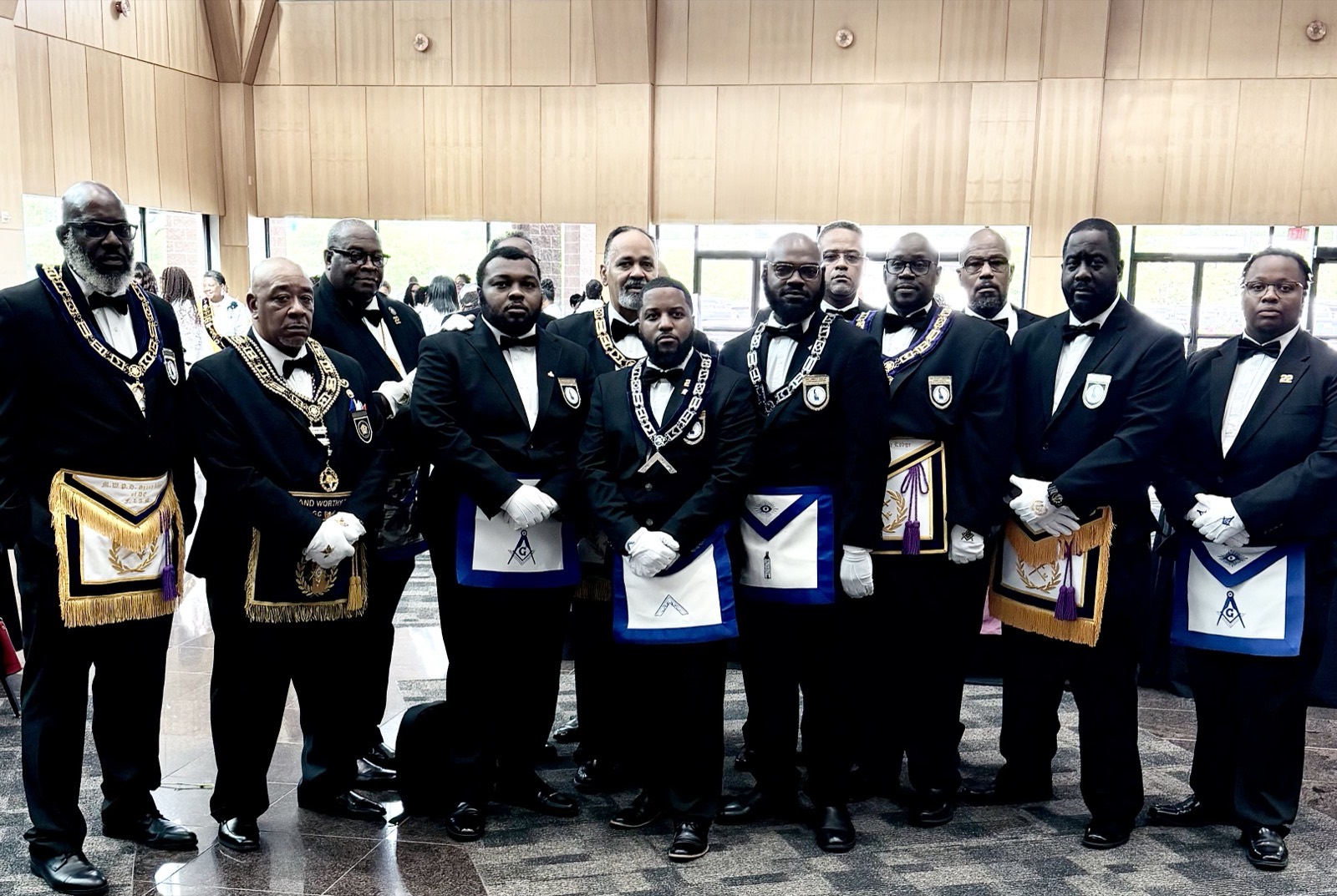 A group of Brothers in formal Masonic regalia at August Quarterly