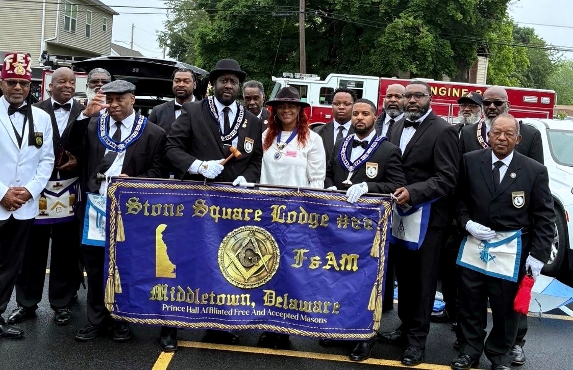 Brothers of Stone Square Lodge No. 22 in regalia at the Middletown Memorial Day parade, holding the Lodge banner